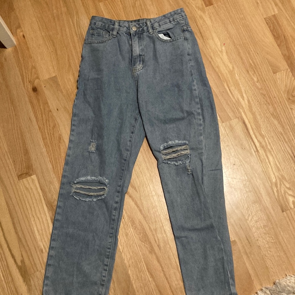 light blue jeans, with holes at your knees and size small.